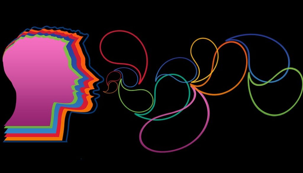 immagine grafica con faccie colaorata che parla su sfondo nero