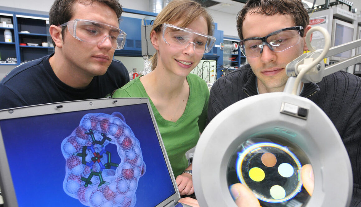 Photovoltaic devices Postdoctoral appointees Ioan Botiz (left), Karen Mulfort and Alex Martinson are exploring the possibility of coupling photovoltaic devices (magnifier) and solar fuel (monitor).