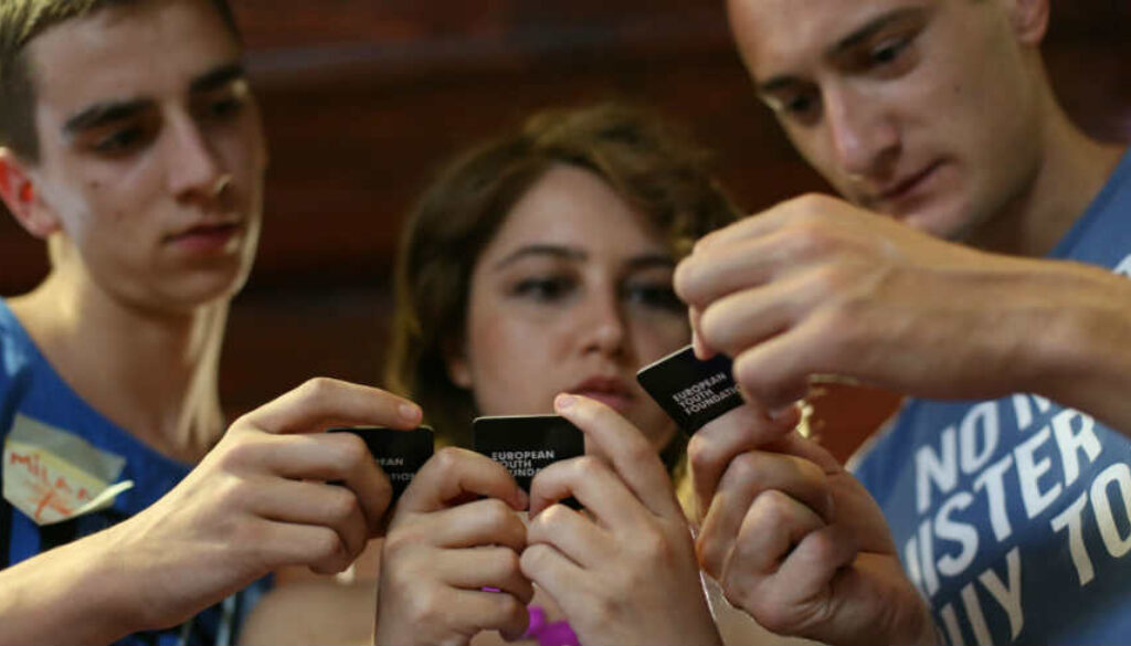 youth playing with EYF game