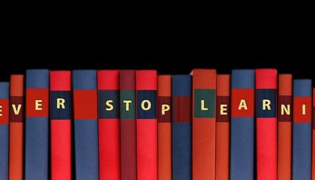 volumi enciclopedia che compongono la frase "never stop learning"