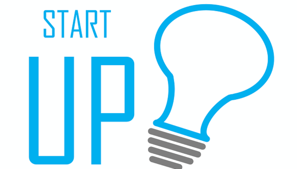 grafica con scritta startup e lampadina